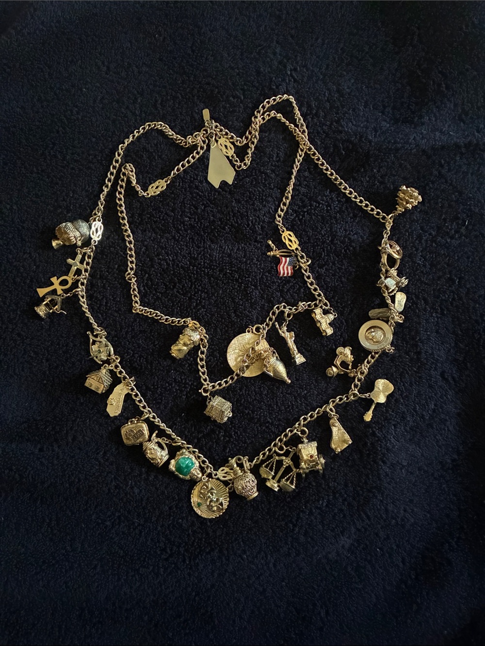 Monet Gold-Tone Multi-Charm Necklace with Green Accent